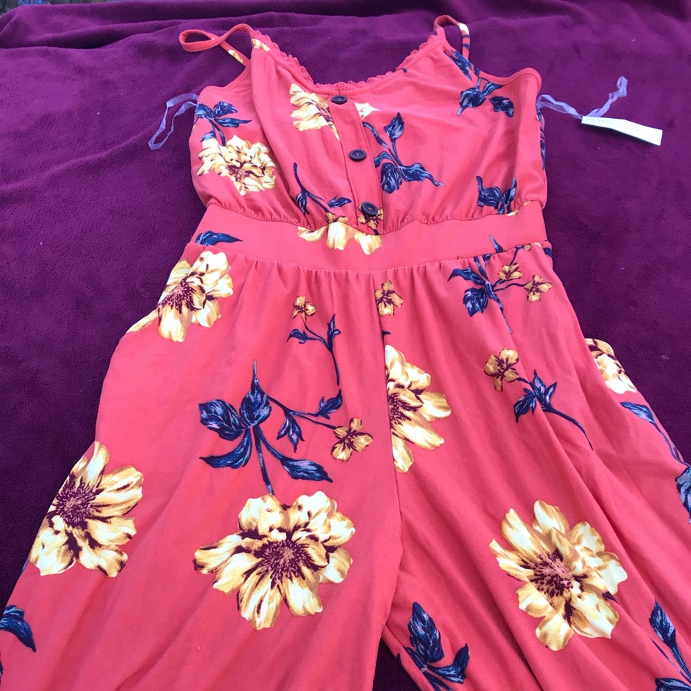 2 rompers size medium and large